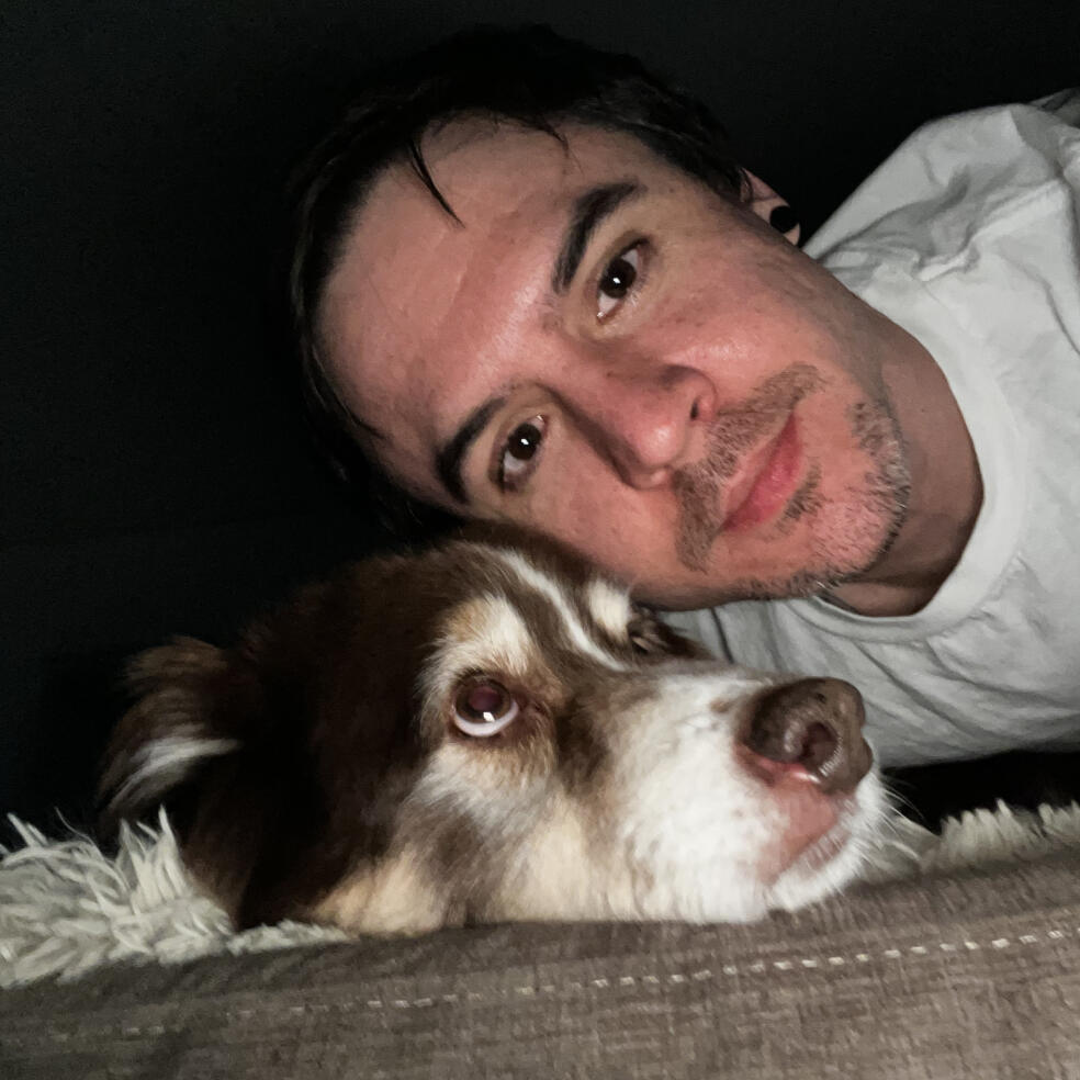 Dan, taking selfie with his dog.